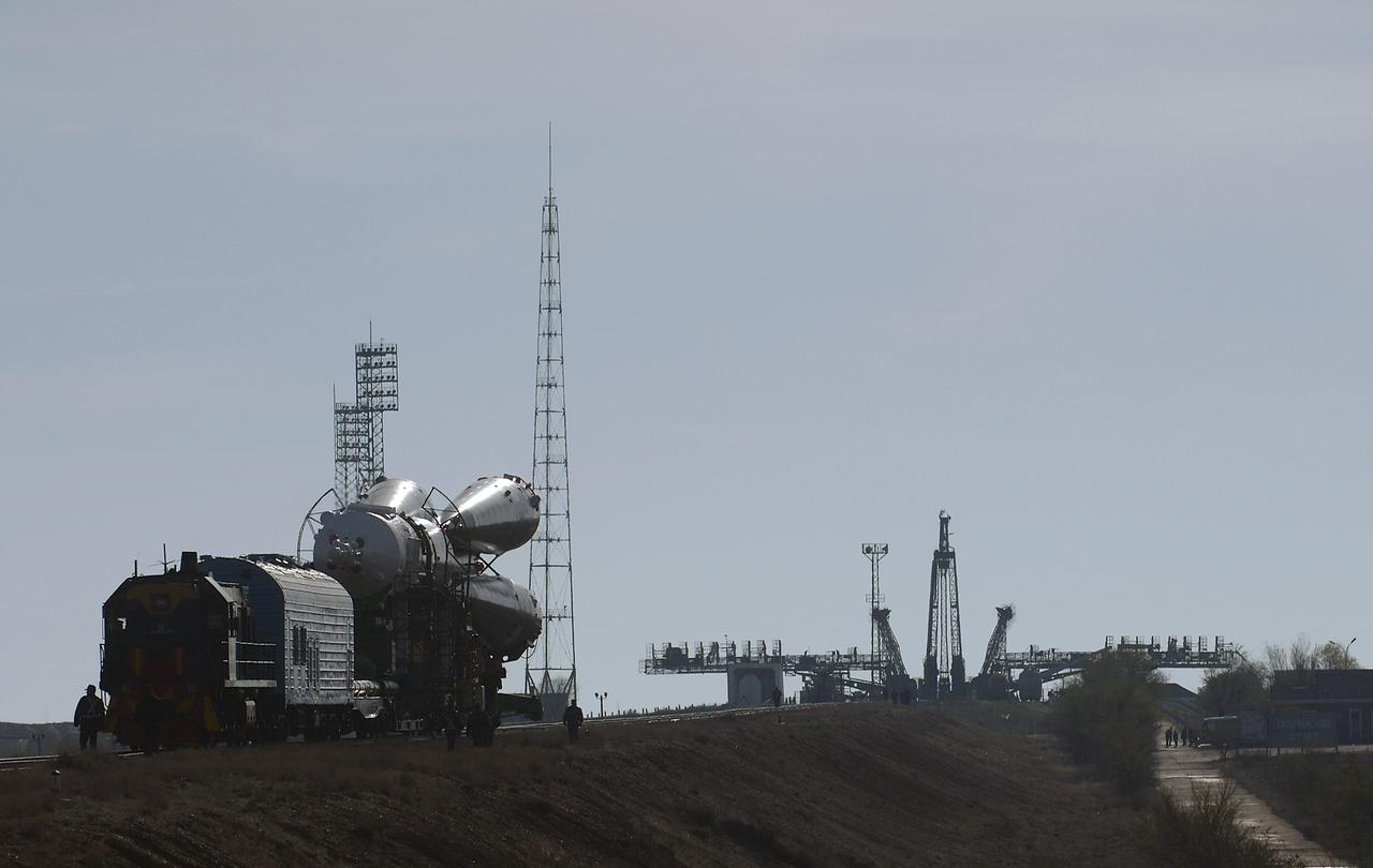 The Soyuz TMA-4 capsule and its booster rocket begin to roll to the launch pad at the Baikonur Cosmodrome on Saturday, April 17, 2004, in Baikonur, Kazakhstan in preparation for the launch of the Expedition 9 crew and a European researcher to the International Space Station on April 19. The Soyuz vehicle is transported to the launch pad horizontally on a railcar from its processing hangar in a process that takes about 2.5 hours to complete. Photo Credit: (NASA/Bill Ingalls)