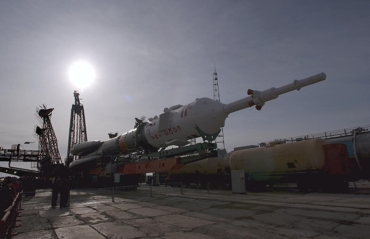 The Soyuz TMA-4 capsule and its booster rocket are raised into position at the launch pad at the Baikonur Cosmodrome on Saturday, April 17, 2004, in Baikonur, Kazakhstan in preparation for the launch of the Expedition 9 crew and a European researcher to the International Space Station on April 19. The Soyuz vehicle is transported to the launch pad horizontally on a railcar from its processing hangar in a process that takes about 2.5 hours to complete. Photo Credit: (NASA/Bill Ingalls)