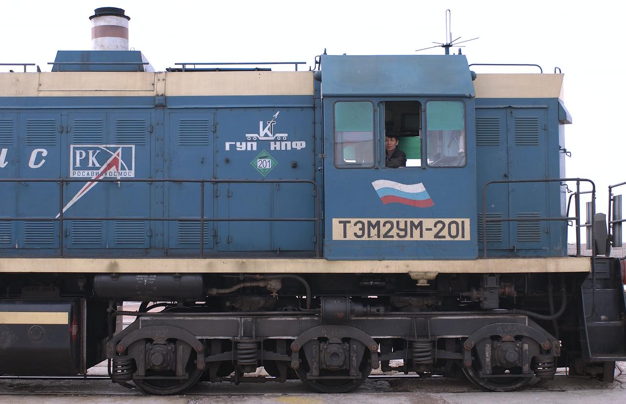 The rollout locomotive prepares to back away from the launch pad leaving the Soyuz TMA-4 capsule and its booster rocket at the Baikonur Cosmodrome on Saturday, April 17, 2004, in Baikonur, Kazakhstan in preparation for the launch of the Expedition 9 crew and a European researcher to the International Space Station on April 19. The Soyuz vehicle is transported to the launch pad horizontally on a railcar from its processing hangar in a process that takes about 2.5 hours to complete. Photo Credit: (NASA/Bill Ingalls)