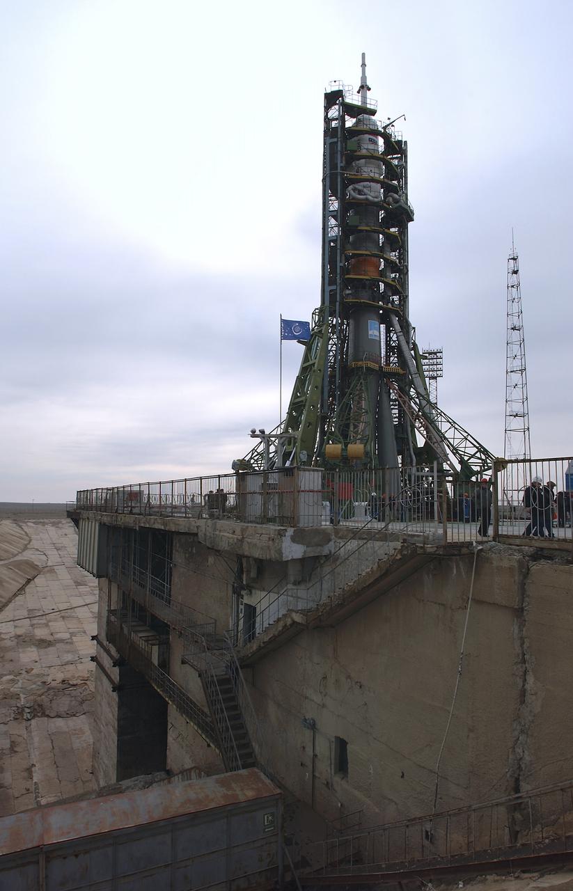The Soyuz TMA-4 capsule and its booster rocket are in position at the launch pad at the Baikonur Cosmodrome in Kazakhstan on April 17, 2004 in preparation for the launch of the Expedition 9 crew and a European researcher to the International Space Station April 19. The Soyuz vehicle is transported to the launch pad horizontally on a railcar from its processing hangar in a process that takes about 2.5 hours to complete. Photo Credit: (NASA/Bill Ingalls)