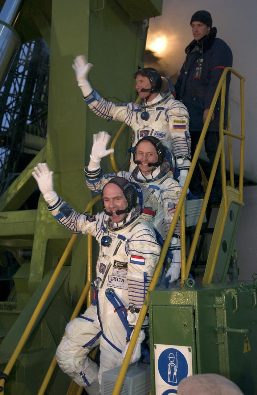 Expedition 9 Commander Gennady Padalka, second from top, Flight Engineer and NASA Science Officer Mike Fincke, second from bottom, and European Space Agency astronaut Andre Kuipers of the Netherlands bid farewell as they prepare to board the Soyuz TMA-4 vehicle on Monday, April 19, in Baikonur, Kazakhstan prior to their launch to the International Space Station. Photo Credit: (NASA/Bill Ingalls)