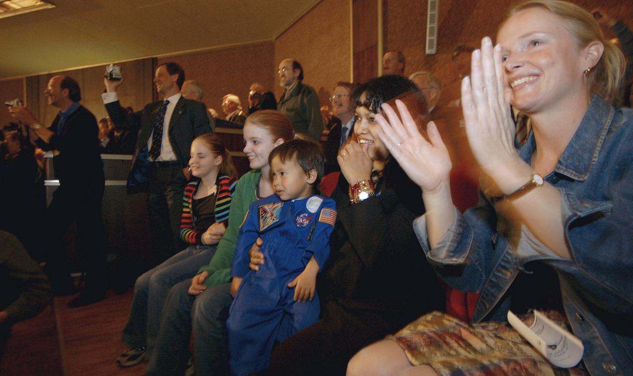 Helen Conijn, fiancée of European Space Agency astronaut Andre Kuipers of the Netherlands, far right, joins Renita Fincke, second from right, wife of Expedition 9 Flight Engineer and NASA International Space Station Science Officer Michael Fincke, along with family members at the Russian Mission Control Center outside Moscow, Wednesday, April 21, 2004 to view the docking of the Soyuz capsule to the International Space Station that brought Kuipers, Fincke and Expedition 9 Commander Gennady Padalka to the complex following their launch Monday from Kazakhstan.  Photo Credit: (NASA/Bill Ingalls)