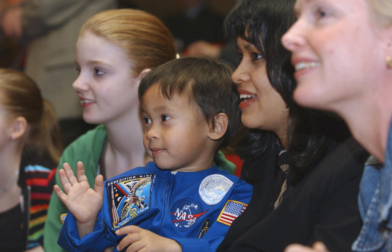 Helen Conijn, fiancée of European Space Agency astronaut Andre Kuipers of the Netherlands, far right, joins Renita Fincke, second from right, wife of Expedition 9 Flight Engineer and NASA International Space Station Science Officer Michael Fincke, along with family members at the Russian Mission Control Center outside Moscow, Wednesday, April 21, 2004 to view the docking of the Soyuz capsule to the International Space Station that brought Kuipers, Fincke and Expedition 9 Commander Gennady Padalka to the complex following their launch Monday from Kazakhstan.  Photo Credit: (NASA/Bill Ingalls)