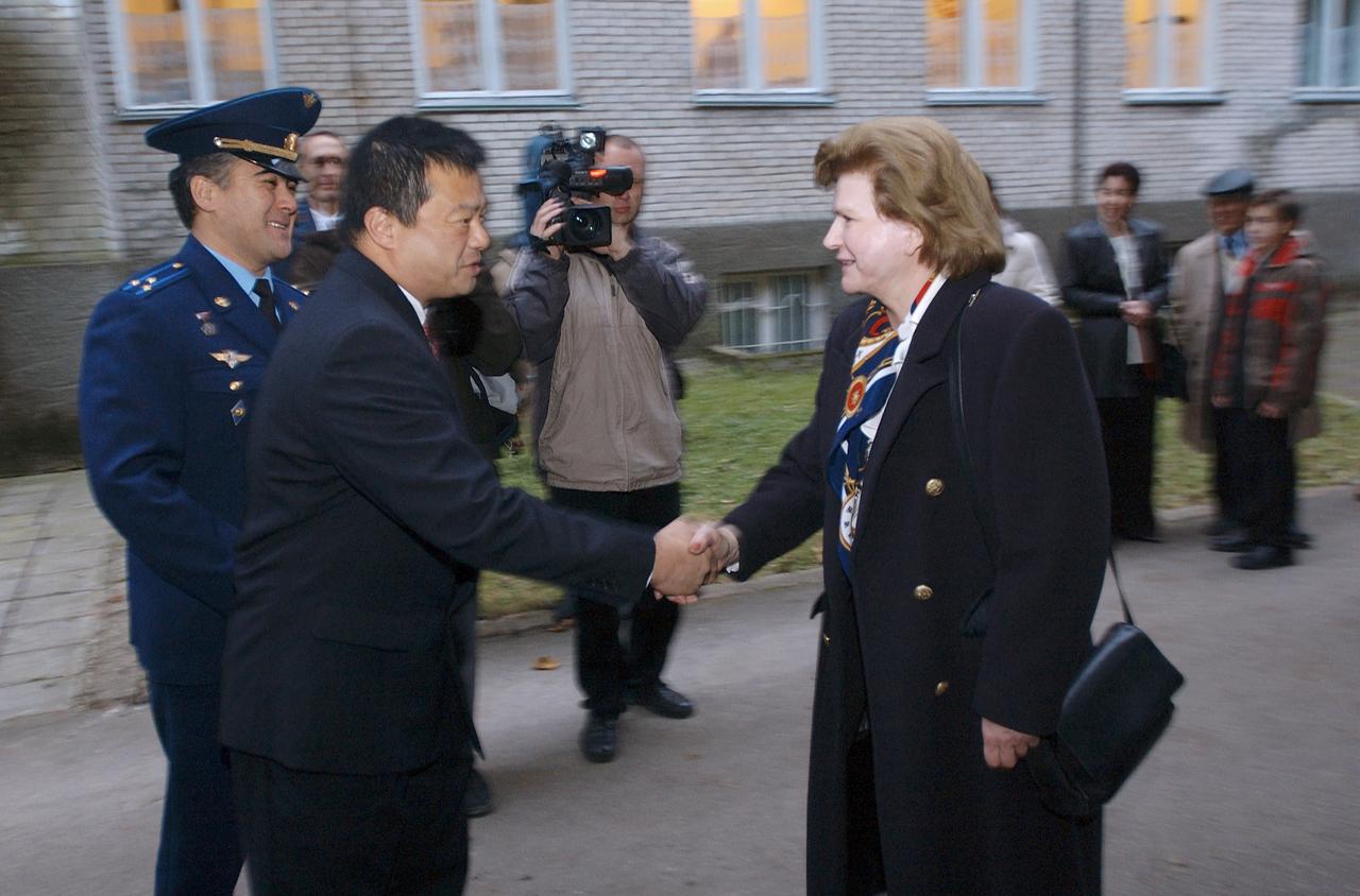 Expedition 10 Commander and NASA Science Officer Leroy Chiao, second from left, and Flight Engineer and Soyuz Commander Salizhan Sharipov greet the first woman to fly in space, Valentina Tereshkova, right, prior to the crews' departure from Star City, Russia to Baikonur, Kazakhstan, Monday, October 4, 2004.  The Expedition 10 crew will launch on the Soyuz TMA-5 spacecraft October 14, 2004 to the International Space Station.  Photo Credit (NASA/Bill Ingalls)     