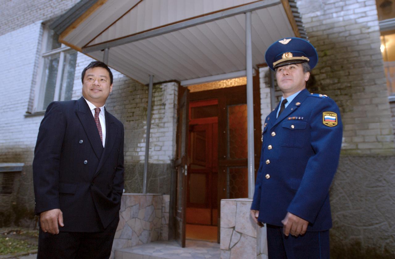 Expedition 10 Commander and NASA Science Officer Leroy Chiao, left, and Flight Engineer and Soyuz Commander Salizhan Sharipov invite VIP’s in for the crew departure breakfast prior to their departure from Star City, Russia for Baikonur, Kazakhstan, Monday, Oct. 4, 2004.   The Expedition 10 crew will launch on the Soyuz TMA-5 spacecraft October 14, 2004 to the International Space Station.  Photo Credit (NASA/Bill Ingalls)        