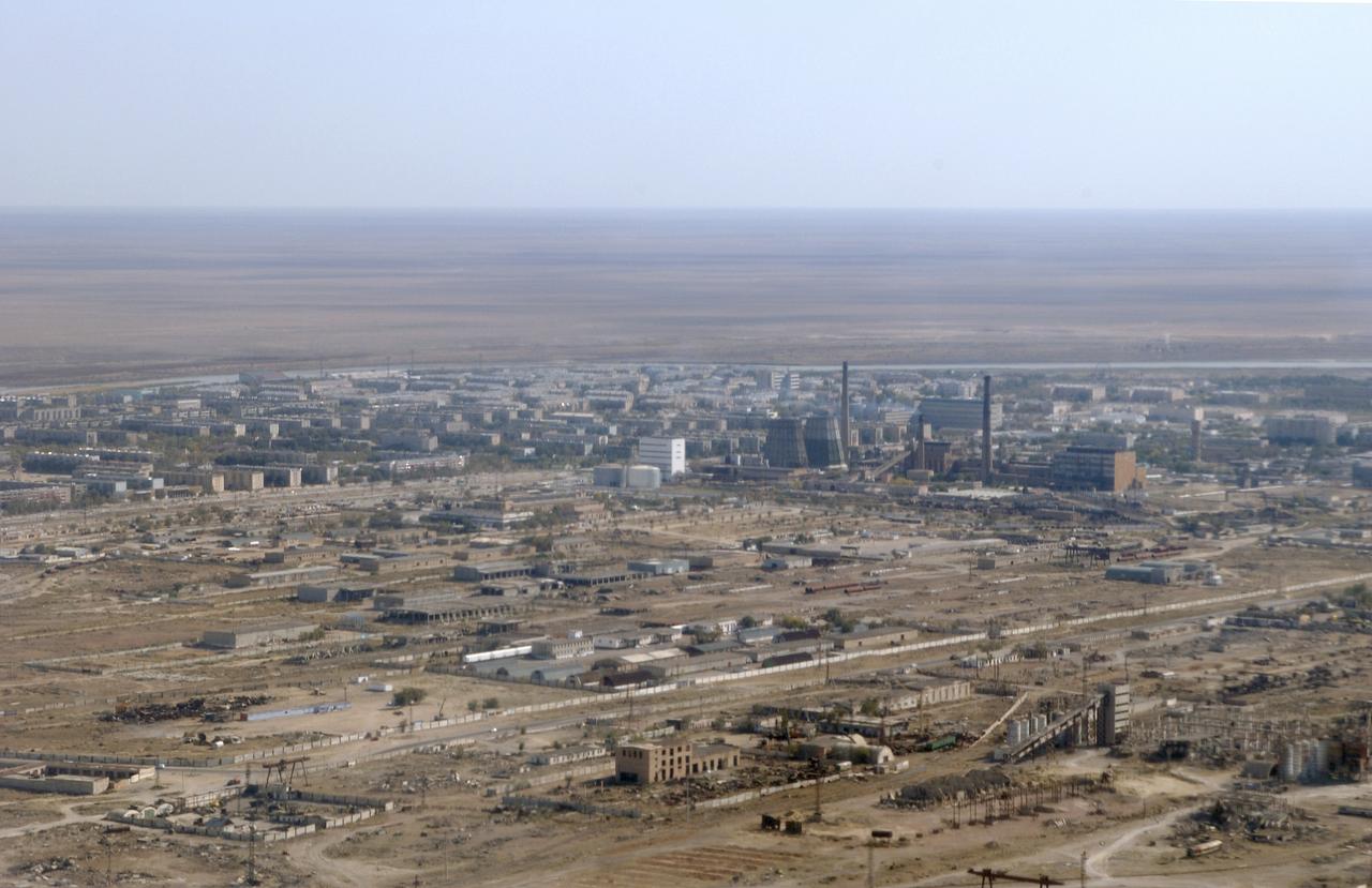 The city of Baikonur, Kazakhstan is seen from the aircraft carrying the Expedition 10 Commander and NASA Science Officer Leroy Chiao, Flight Engineer and Soyuz Commander Salizhan Sharipov and Russian Space Forces cosmonaut Yuri Shargin, Monday, Oct. 4, 2004.  The crew will prepare for their launch on the Soyuz TMA-5 spacecraft October 14, 2004 to the International Space Station.  Photo Credit (NASA/Bill Ingalls)