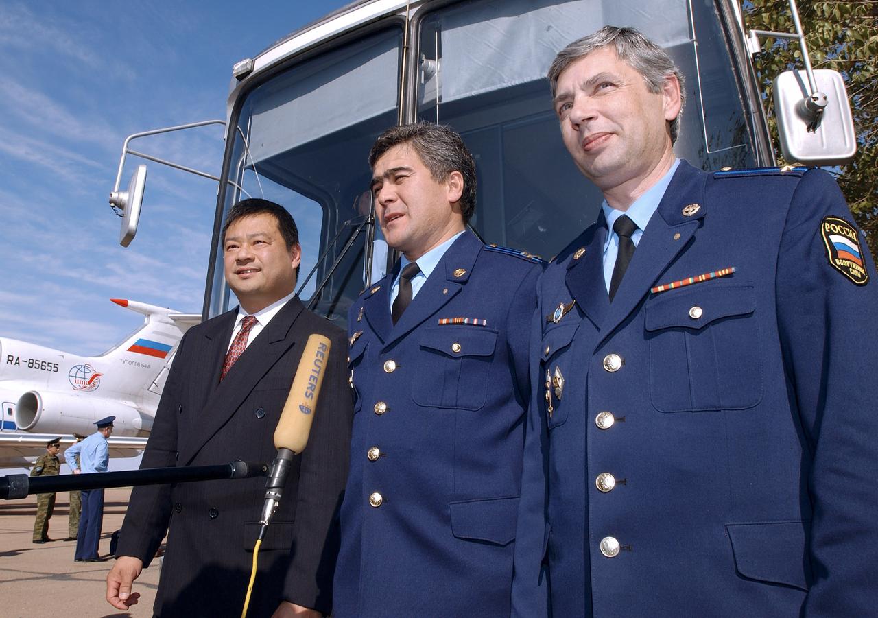 Russian Space Forces cosmonaut Yuri Shargin, right, Flight Engineer and Soyuz Commander Salizhan Sharipov and Expedition 10 Commander and NASA Science Officer Leroy Chiao, left, talk to the press in Baikonur, Kazakhstan after their arrival from Star City, Russia, Monday, Oct. 4, 2004. The crew will prepare for their launch on the Soyuz TMA-5 spacecraft October 14, 2004 to the International Space Station. Chiao and Sharipov will spend six months on the Station, while Shargin will return to Earth October 24 with Expedition 9 Commander Gennady Padalka and NASA Science Officer and Flight Engineer Mike Fincke, who have been in space since April. Photo Credit (NASA/Bill Ingalls)                            