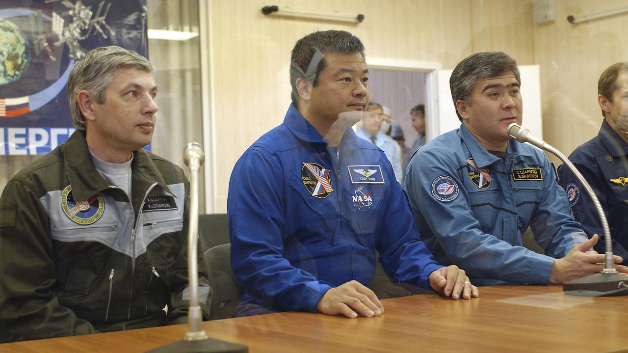 From Left to Right, Russian Space Forces cosmonaut Yuri Shargin, Expedition 10 Commander and NASA Science Officer Leroy Chiao, and Flight Engineer and Soyuz Commander Salizhan Sharipov report to space officials on the results of the dress rehearsal of their launch activities Tuesday, October 5, 2004, at the Baikonur Cosmodrome in Kazakhstan. Chiao, Sharipov and Shargin are scheduled to launch October 14 on their Soyuz TMA-5 spacecraft to the International Space Station.  Photo Credit: (NASA/Bill Ingalls)