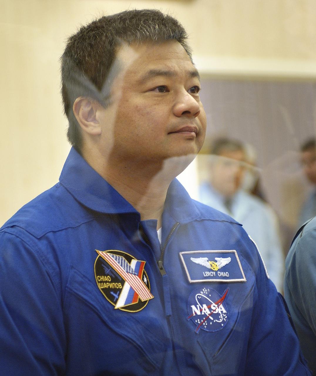 Expedition 10 Commander and NASA Science Officer Leroy Chiao reports from a glass enclosed room to space officials on the results of the dress rehearsal of their launch activities Friday, October 5, 2004, at the Baikonur Cosmodrome in Kazakhstan. Chiao, Sharipov and Shargin are scheduled to launch October 14 on their Soyuz TMA-5 spacecraft to the International Space Station.  Photo Credit: (NASA/Bill Ingalls)