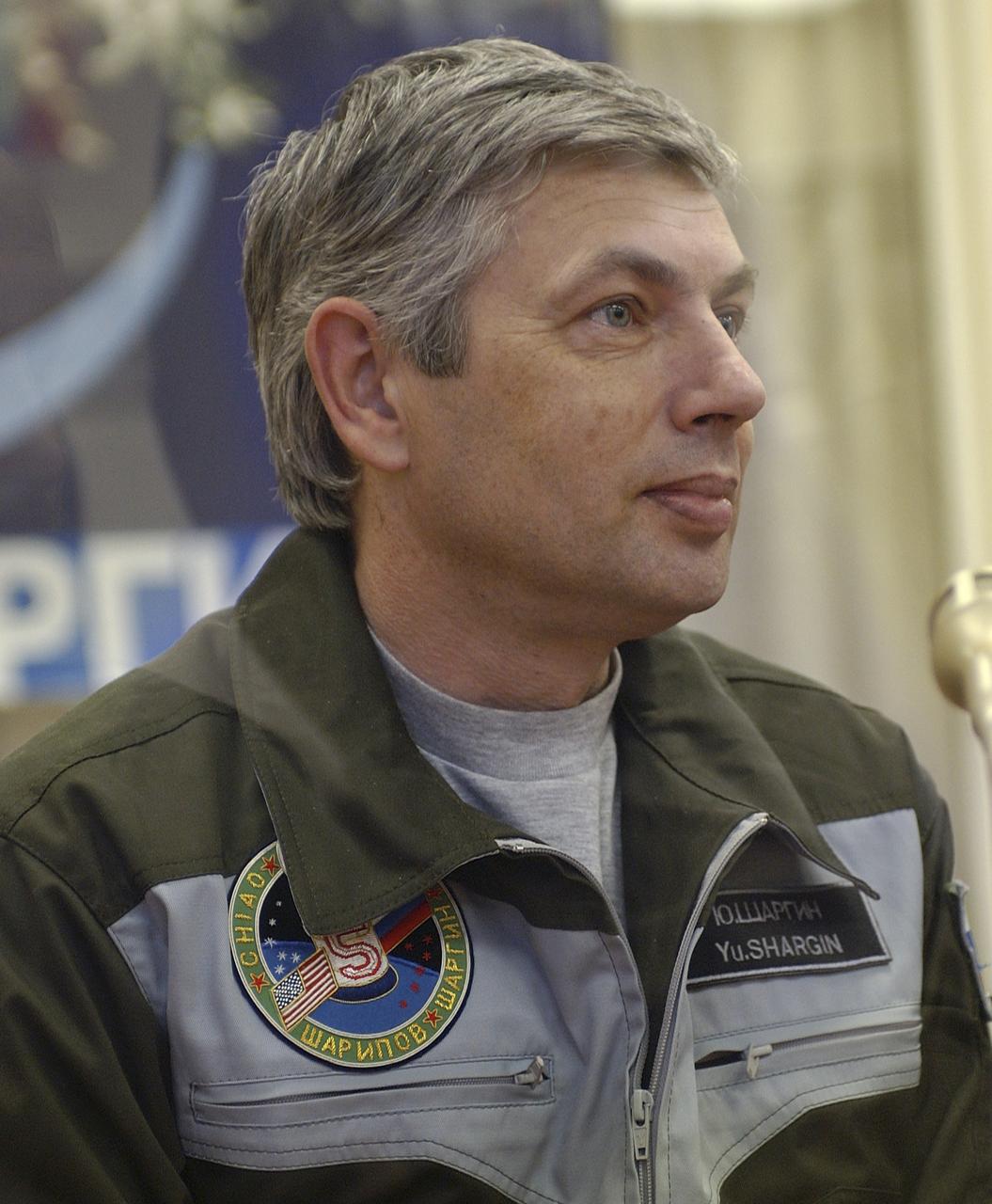 Russian Space Forces cosmonaut Yuri Shargin reports from behind the glass to space officials on the results of the dress rehearsal of their launch activities Friday, October 5, 2004, at the Baikonur Cosmodrome in Kazakhstan. Chiao, Sharipov and Shargin are scheduled to launch October 14 on their Soyuz TMA-5 spacecraft to the International Space Station. Photo Credit: (NASA/Bill Ingalls)