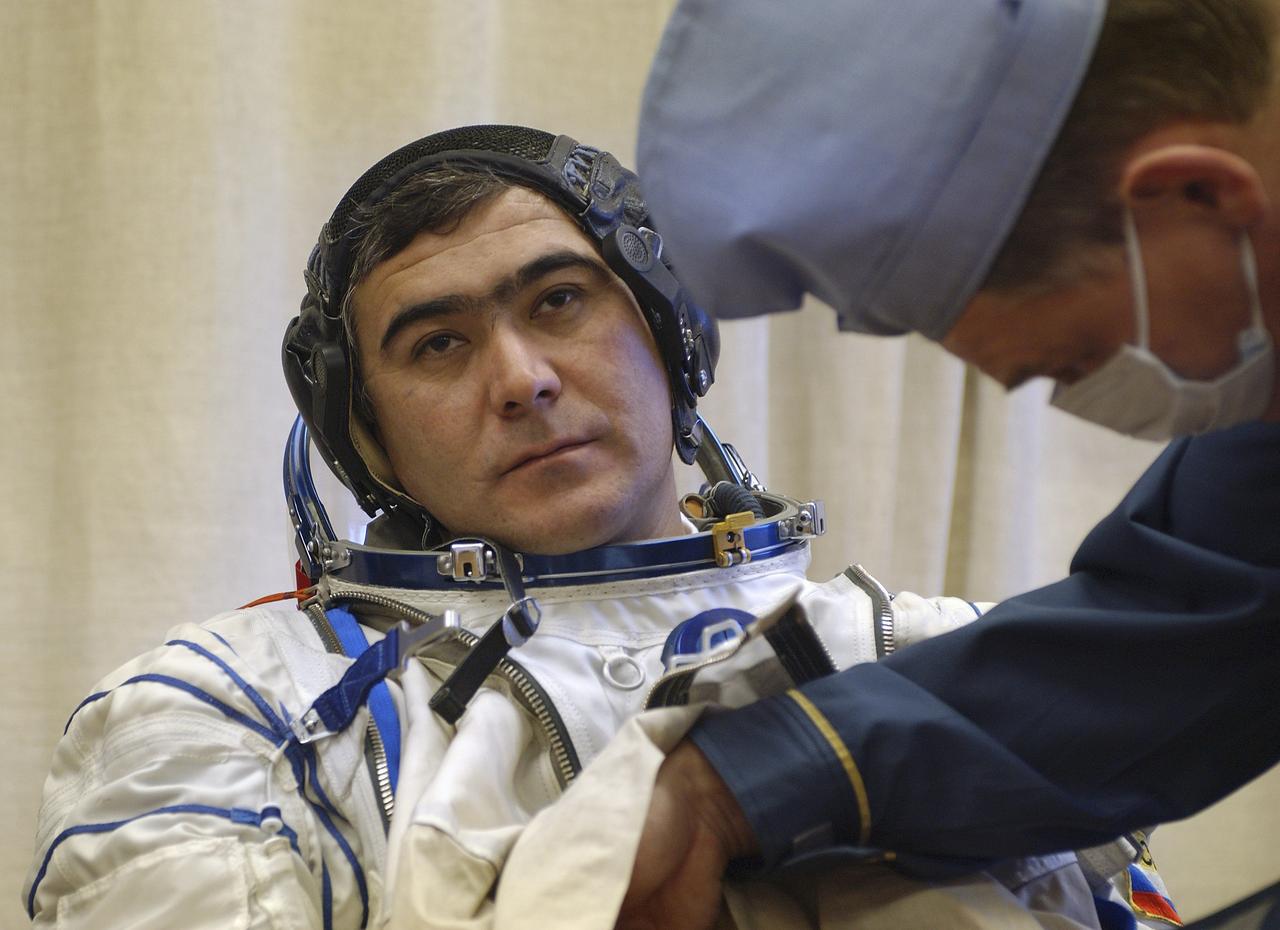 Expedition 10 Flight Engineer and Soyuz Commander Salizhan Sharipov donned his launch and entry suit and climbed aboard the Soyuz TMA-5 spacecraft Friday, October 5, 2004 at the Baikonur Cosmodrome in Kazakhstan for a dress rehearsal of launch day activities leading to their liftoff October 14 to the International Space Station. Chiao and Sharipov, the first crew of all-Asian extraction, will spend six months on the Station.  Shargin will return to Earth October 24 with the Stations' current residents, Expedition 9 Commander Gennady Padalka and NASA Flight Engineer and Science Officer Mike Fincke.  Photo Credit: (NASA/Bill Ingalls)