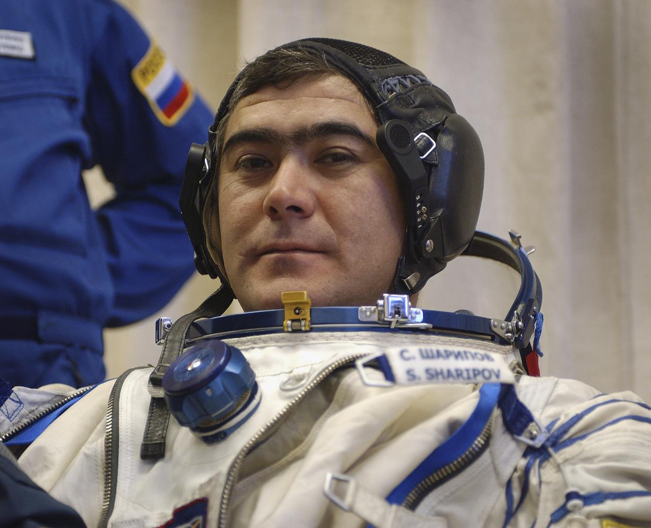 Expedition 10 Flight Engineer and Soyuz Commander Salizhan Sharipov donned his launch and entry suit and climbed aboard the Soyuz TMA-5 spacecraft Friday, October 5, 2004 at the Baikonur Cosmodrome in Kazakhstan for a dress rehearsal of launch day activities leading to their liftoff October 14 to the International Space Station. Chiao and Sharipov, the first crew of all-Asian extraction, will spend six months on the Station.  Shargin will return to Earth October 24 with the Stations' current residents, Expedition 9 Commander Gennady Padalka and NASA Flight Engineer and Science Officer Mike Fincke.  Photo Credit: (NASA/Bill Ingalls)