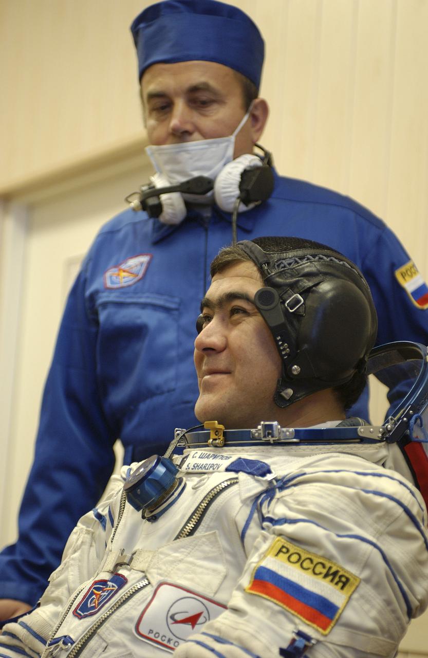Expedition 10 Flight Engineer and Soyuz Commander Salizhan Sharipov donned his launch and entry suit and climbed aboard the Soyuz TMA-5 spacecraft Friday, October 5, 2004 at the Baikonur Cosmodrome in Kazakhstan for a dress rehearsal of launch day activities leading to their liftoff October 14 to the International Space Station. Chiao and Sharipov, the first crew of all-Asian extraction, will spend six months on the Station.  Shargin will return to Earth October 24 with the Stations' current residents, Expedition 9 Commander Gennady Padalka and NASA Flight Engineer and Science Officer Mike Fincke.  Photo Credit: (NASA/Bill Ingalls)