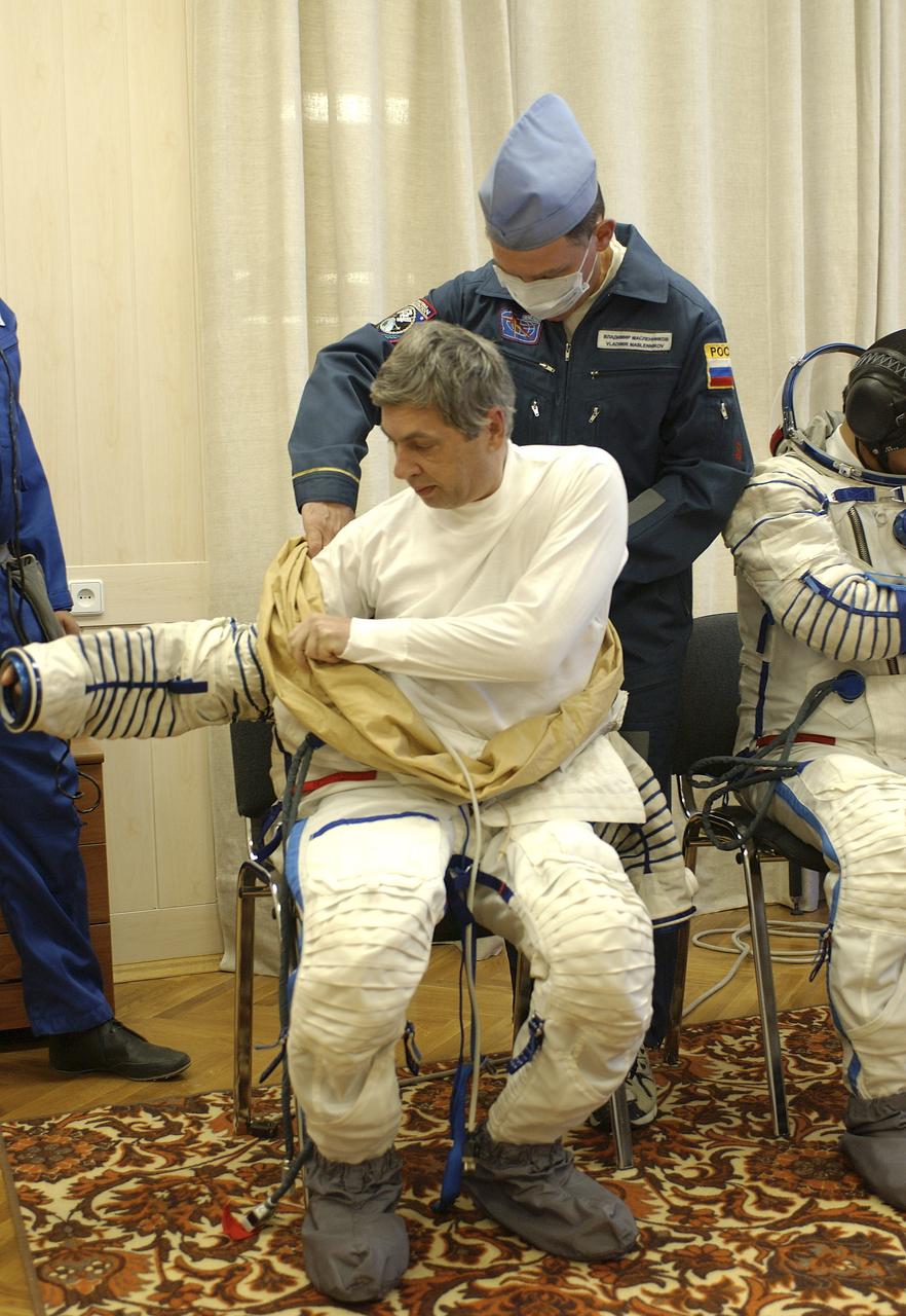 Russian Space Forces cosmonaut Yuri Shargin donned his launch and entry suit and climbed aboard the Soyuz TMA-5 spacecraft Friday, October 5, 2004, at the Baikonur Cosmodrome in Kazakhstan for a dress rehearsal of launch day activities leading to their liftoff October 14 to the International Space Station.  Chiao and Sharipov, the first crew of all-Asian extraction, will spend six months on the Station.  Shargin will return to Earth October 24 with the Stations' current residents, Expedition 9 Commander Gennady Padalka and NASA Flight Engineer and Science Officer Mike Fincke.  Photo Credit: (NASA/Bill Ingalls)