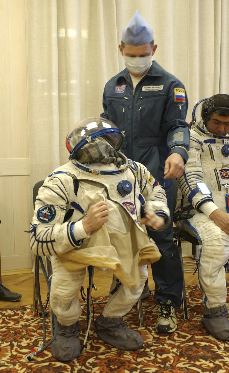 Russian Space Forces cosmonaut Yuri Shargin donned his launch and entry suit and climbed aboard the Soyuz TMA-5 spacecraft Friday, October 5, 2004, at the Baikonur Cosmodrome in Kazakhstan for a dress rehearsal of launch day activities leading to their liftoff October 14 to the International Space Station.  Chiao and Sharipov, the first crew of all-Asian extraction, will spend six months on the Station.  Shargin will return to Earth October 24 with the Stations' current residents, Expedition 9 Commander Gennady Padalka and NASA Flight Engineer and Science Officer Mike Fincke.  Photo Credit: (NASA/Bill Ingalls)