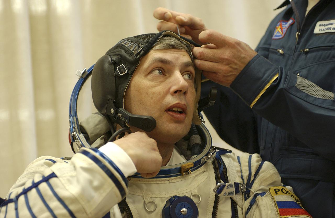 Russian Space Forces cosmonaut Yuri Shargin donned his launch and entry suit and climbed aboard the Soyuz TMA-5 spacecraft Friday, October 5, 2004, at the Baikonur Cosmodrome in Kazakhstan for a dress rehearsal of launch day activities leading to their liftoff October 14 to the International Space Station.  Chiao and Sharipov, the first crew of all-Asian extraction, will spend six months on the Station.  Shargin will return to Earth October 24 with the Stations' current residents, Expedition 9 Commander Gennady Padalka and NASA Flight Engineer and Science Officer Mike Fincke.  Photo Credit: (NASA/Bill Ingalls)