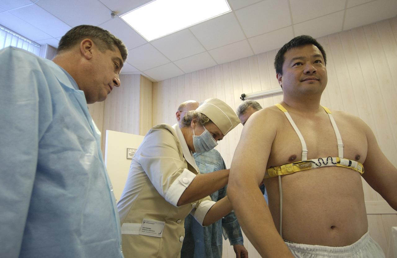 Expedition 10 Commander and NASA Science Officer Leroy Chiao donned his launch and entry suit and climbed aboard the Soyuz TMA-5 spacecraft Friday, October 5, 2004, at the Baikonur Cosmodrome in Kazakhstan for a dress rehearsal of launch day activities leading to their liftoff October 14 to the International Space Station.  Chiao and Sharipov, the first crew of all-Asian extraction, will spend six months on the Station.  Shargin will return to Earth October 24 with the Stations' current residents, Expedition 9 Commander Gennady Padalka and NASA Flight Engineer and Science Officer Mike Fincke.  Photo Credit: (NASA/Bill Ingalls)