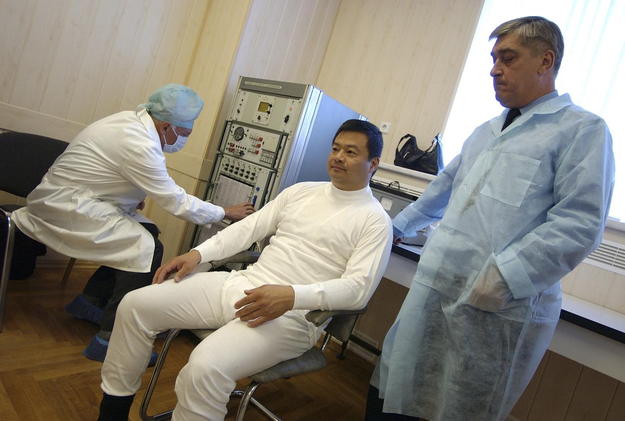 Expedition 10 Commander and NASA Science Officer Leroy Chiao donned his launch and entry suit and climbed aboard the Soyuz TMA-5 spacecraft Friday, October 5, 2004, at the Baikonur Cosmodrome in Kazakhstan for a dress rehearsal of launch day activities leading to their liftoff October 14 to the International Space Station.  Chiao and Sharipov, the first crew of all-Asian extraction, will spend six months on the Station.  Shargin will return to Earth October 24 with the Stations' current residents, Expedition 9 Commander Gennady Padalka and NASA Flight Engineer and Science Officer Mike Fincke.  Photo Credit: (NASA/Bill Ingalls)