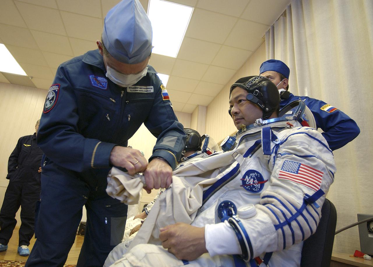 Expedition 10 Commander and NASA Science Officer Leroy Chiao donned his launch and entry suit and climbed aboard the Soyuz TMA-5 spacecraft Friday, October 5, 2004, at the Baikonur Cosmodrome in Kazakhstan for a dress rehearsal of launch day activities leading to their liftoff October 14 to the International Space Station.  Chiao and Sharipov, the first crew of all-Asian extraction, will spend six months on the Station.  Shargin will return to Earth October 24 with the Stations' current residents, Expedition 9 Commander Gennady Padalka and NASA Flight Engineer and Science Officer Mike Fincke.  Photo Credit: (NASA/Bill Ingalls) 
