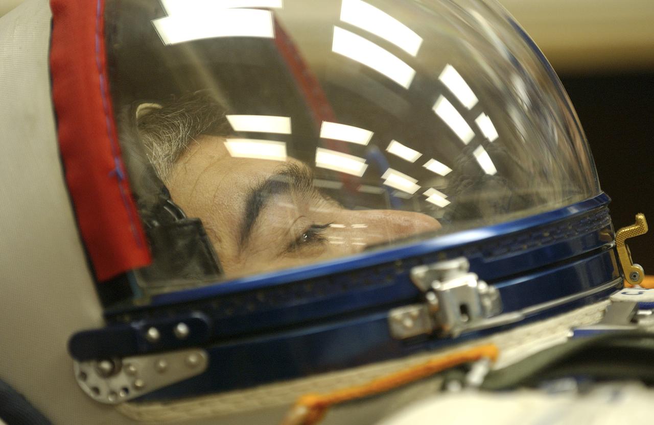 Expedition 10 Flight Engineer and Soyuz Commander Salizhan Sharipov donned his launch and entry suit and climbed aboard the Soyuz TMA-5 spacecraft Friday, October 5, 2004 at the Baikonur Cosmodrome in Kazakhstan for a dress rehearsal of launch day activities leading to their liftoff October 14 to the International Space Station. Chiao and Sharipov, the first crew of all-Asian extraction, will spend six months on the Station.  Shargin will return to Earth October 24 with the Stations' current residents, Expedition 9 Commander Gennady Padalka and NASA Flight Engineer and Science Officer Mike Fincke.  Photo Credit: (NASA/Bill Ingalls) 