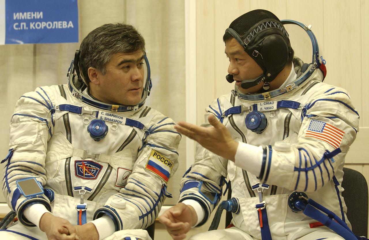 Expedition 10 Commander and NASA Science Officer Leroy Chiao, right, Flight Engineer and Soyuz Commander Salizhan Sharipov donned their launch and entry suits and climbed aboard their Soyuz TMA-5 spacecraft Friday, October 5, 2004, at the Baikonur Cosmodrome in Kazakhstan for a dress rehearsal of launch day activities leading to their liftoff October 14 to the International Space Station.  Chiao and Sharipov, the first crew of all-Asian extraction, will spend six months on the Station.  Shargin will return to Earth October 24 with the Stations' current residents, Expedition 9 Commander Gennady Padalka and NASA Flight Engineer and Science Officer Mike Fincke.  Photo Credit: (NASA/Bill Ingalls) 