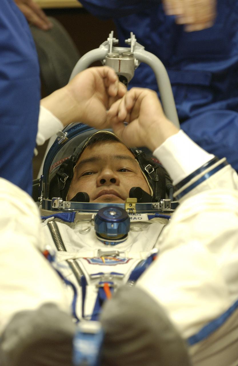 Expedition 10 Commander and NASA Science Officer Leroy Chiao, right, Flight Engineer and Soyuz Commander Salizhan Sharipov donned their launch and entry suits and climbed aboard their Soyuz TMA-5 spacecraft Friday, October 5, 2004, at the Baikonur Cosmodrome in Kazakhstan for a dress rehearsal of launch day activities leading to their liftoff October 14 to the International Space Station.  Chiao and Sharipov, the first crew of all-Asian extraction, will spend six months on the Station.  Shargin will return to Earth October 24 with the Stations' current residents, Expedition 9 Commander Gennady Padalka and NASA Flight Engineer and Science Officer Mike Fincke.  Photo Credit: (NASA/Bill Ingalls)