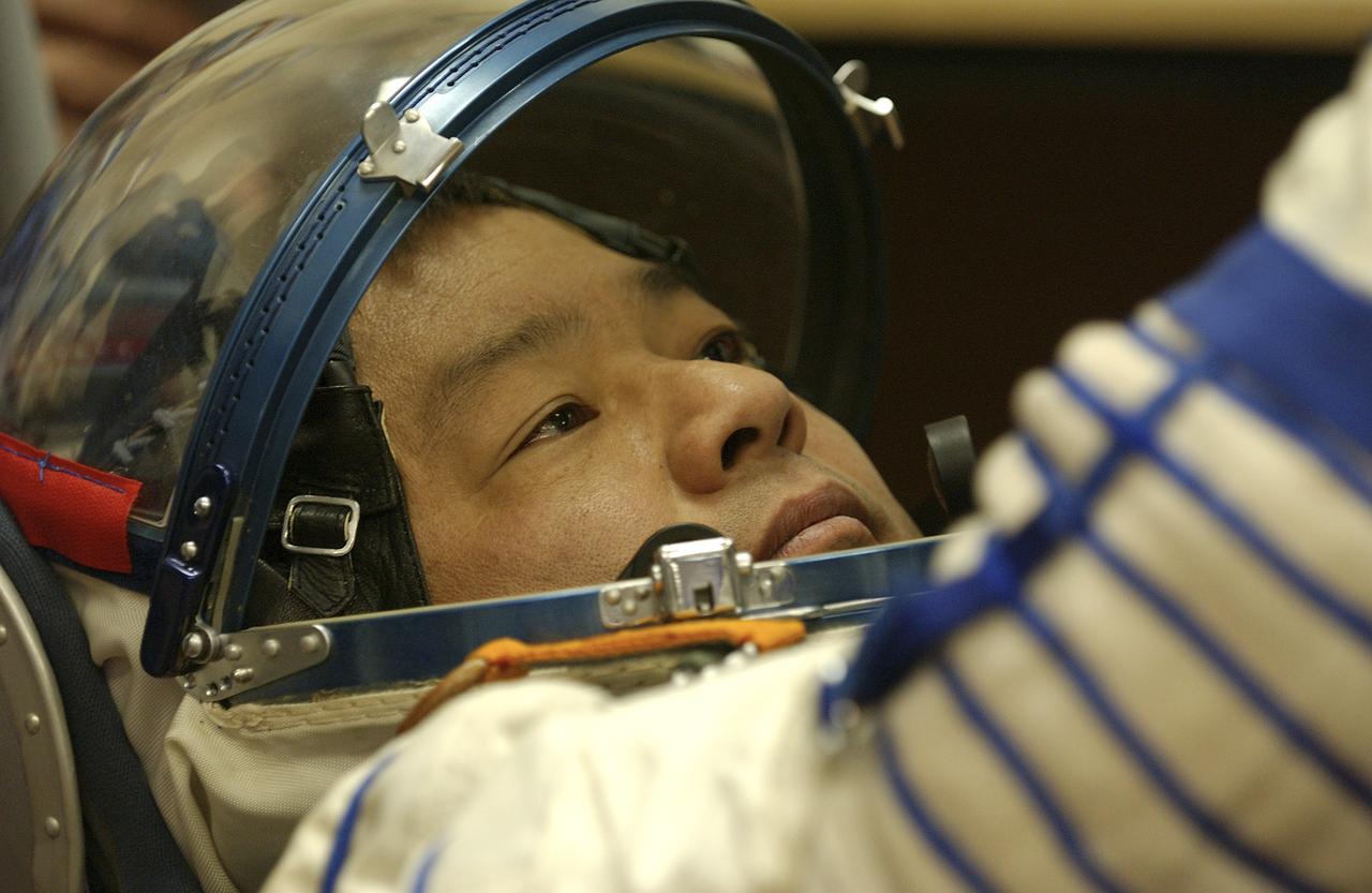 Expedition 10 Commander and NASA Science Officer Leroy Chiao, right, Flight Engineer and Soyuz Commander Salizhan Sharipov donned their launch and entry suits and climbed aboard their Soyuz TMA-5 spacecraft Friday, October 5, 2004, at the Baikonur Cosmodrome in Kazakhstan for a dress rehearsal of launch day activities leading to their liftoff October 14 to the International Space Station.  Chiao and Sharipov, the first crew of all-Asian extraction, will spend six months on the Station.  Shargin will return to Earth October 24 with the Stations' current residents, Expedition 9 Commander Gennady Padalka and NASA Flight Engineer and Science Officer Mike Fincke.  Photo Credit: (NASA/Bill Ingalls) 