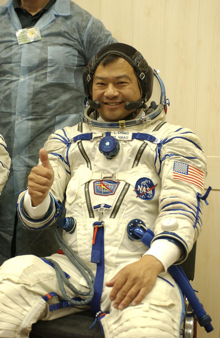 Expedition 10 Commander and NASA Science Officer Leroy Chiao, right, Flight Engineer and Soyuz Commander Salizhan Sharipov and Russian Space Forces cosmonaut Yuri Shargin, left, donned their launch and entry suits and climbed aboard their Soyuz TMA-5 spacecraft Friday, October 5, 2004, at the Baikonur Cosmodrome in Kazakhstan for a dress rehearsal of launch day activities leading to their liftoff October 14 to the International Space Station. Chiao and Sharipov, the first crew of all-Asian extraction, will spend six months on the Station.  Shargin will return to Earth October 24 with the Stations' current residents, Expedition 9 Commander Gennady Padalka and NASA Flight Engineer and Science Officer Mike Fincke.  Photo Credit: (NASA/Bill Ingalls) 