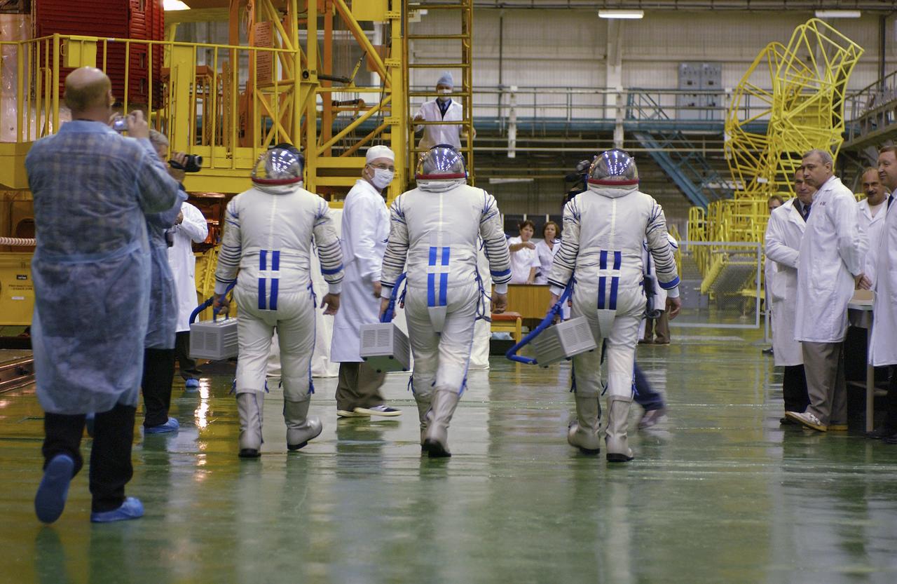 Expedition 10 Flight Engineer and Soyuz Commander Salizhan Sharipov, Expedition 10 Commander and NASA Science Officer Leroy Chiao, Russian Space Forces cosmonaut Yuri Shargin donned their launch and entry suits and climbed aboard their Soyuz TMA-5 spacecraft Friday, October 5, 2004, at the Baikonur Cosmodrome in Kazakhstan for a dress rehearsal of launch day activities leading to their liftoff October 14 to the International Space Station.  Chiao and Sharipov, the first crew of all-Asian extraction, will spend six months on the Station.  Shargin will return to Earth October 24 with the Stations' current residents, Expedition 9 Commander Gennady Padalka and NASA Flight Engineer and Science Officer Mike Fincke.  Photo Credit: (NASA/Bill Ingalls)