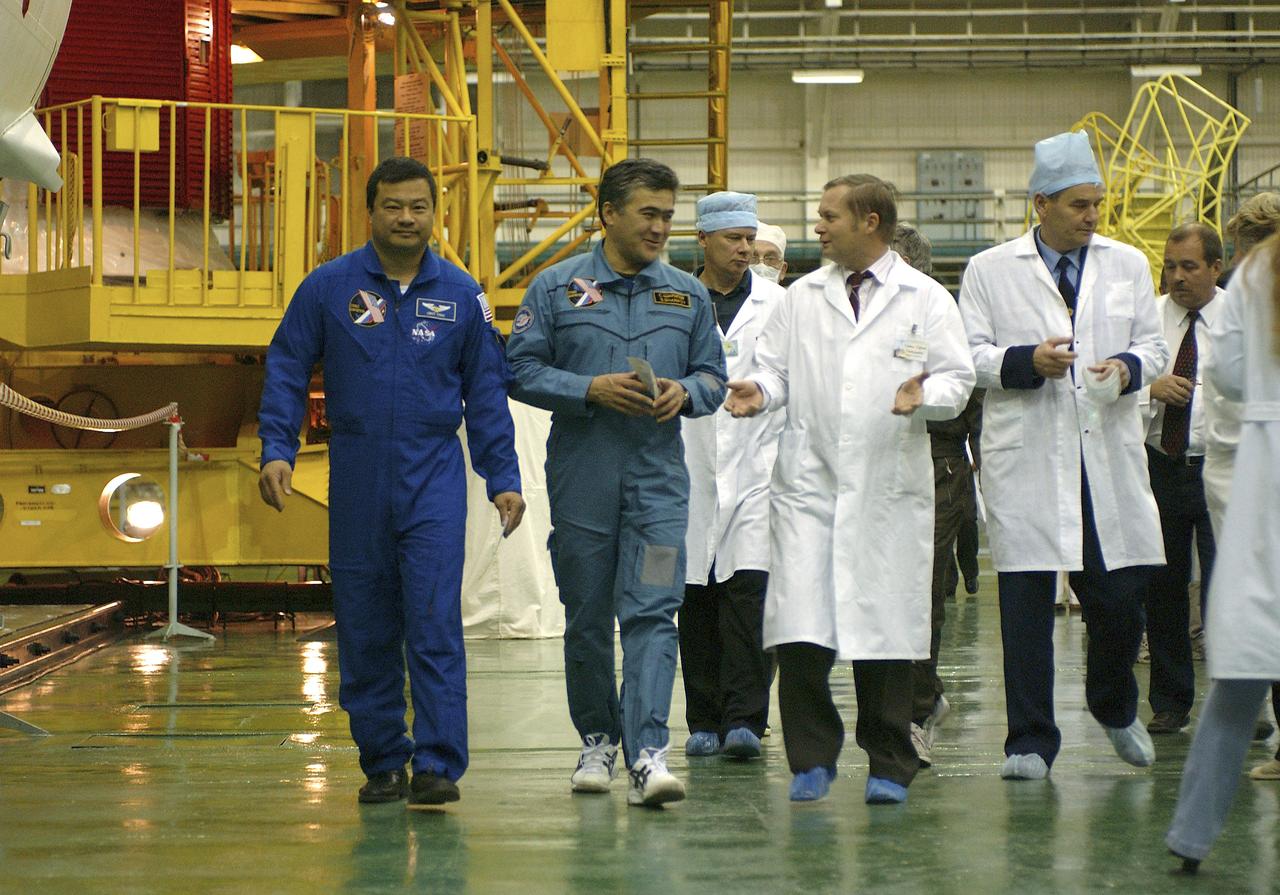 Expedition 10 Commander and NASA Science Officer Leroy Chiao, left, and Flight Engineer and Soyuz Commander Salizhan Sharipov donned their launch and entry suits and climbed aboard their Soyuz TMA-5 spacecraft Friday, October 5, 2004, at the Baikonur Cosmodrome in Kazakhstan for a dress rehearsal of launch day activities leading to their liftoff October 14 to the International Space Station.  Chiao and Sharipov, the first crew of all-Asian extraction, will spend six months on the Station.  Shargin will return to Earth October 24 with the Stations' current residents, Expedition 9 Commander Gennady Padalka and NASA Flight Engineer and Science Officer Mike Fincke.  Photo Credit: (NASA/Bill Ingalls) 