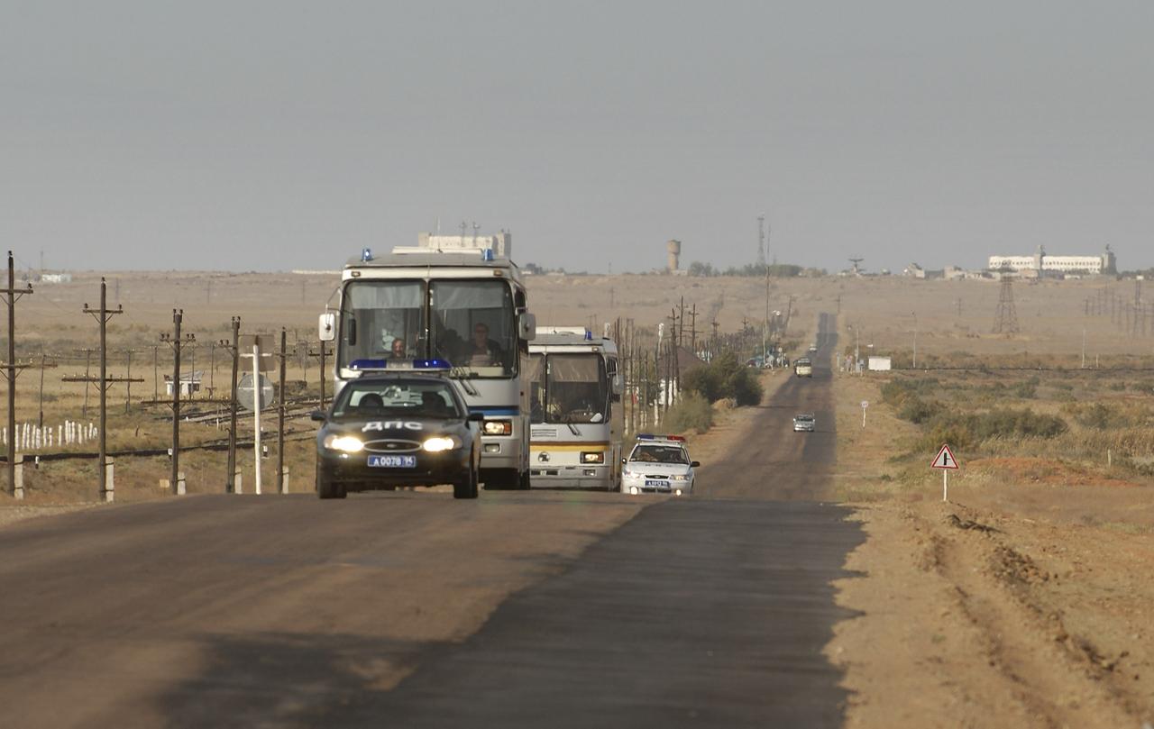 The prime and backup crew buses are escorted through the Baikonur Cosmodrome as the crew returns to the Cosmonaut Hotel. Expedition 10 Commander and NASA Science Officer Leroy Chiao, Flight Engineer and Soyuz Commander Salizhan Sharipov and Russian Space Forces Cosmonaut Yuri Shargin donned their launch and entry suits and climbed aboard their Soyuz TMA-5 spacecraft October 5, 2004 at the Baikonur Cosmodrome in Kazakhstan for a dress rehearsal of launch day activities leading to their liftoff October 14 to the International Space Station. Chiao and Sharipov, the first crew of all-Asian extraction, will spend six months on the Station, while Shargin will return to Earth October 24 with the Station’s current residents, Expedition 9 Commander Gennady Padalka and NASA Flight Engineer and Science Officer Mike Fincke. Photo Credit: “NASA/Bill Ingalls”