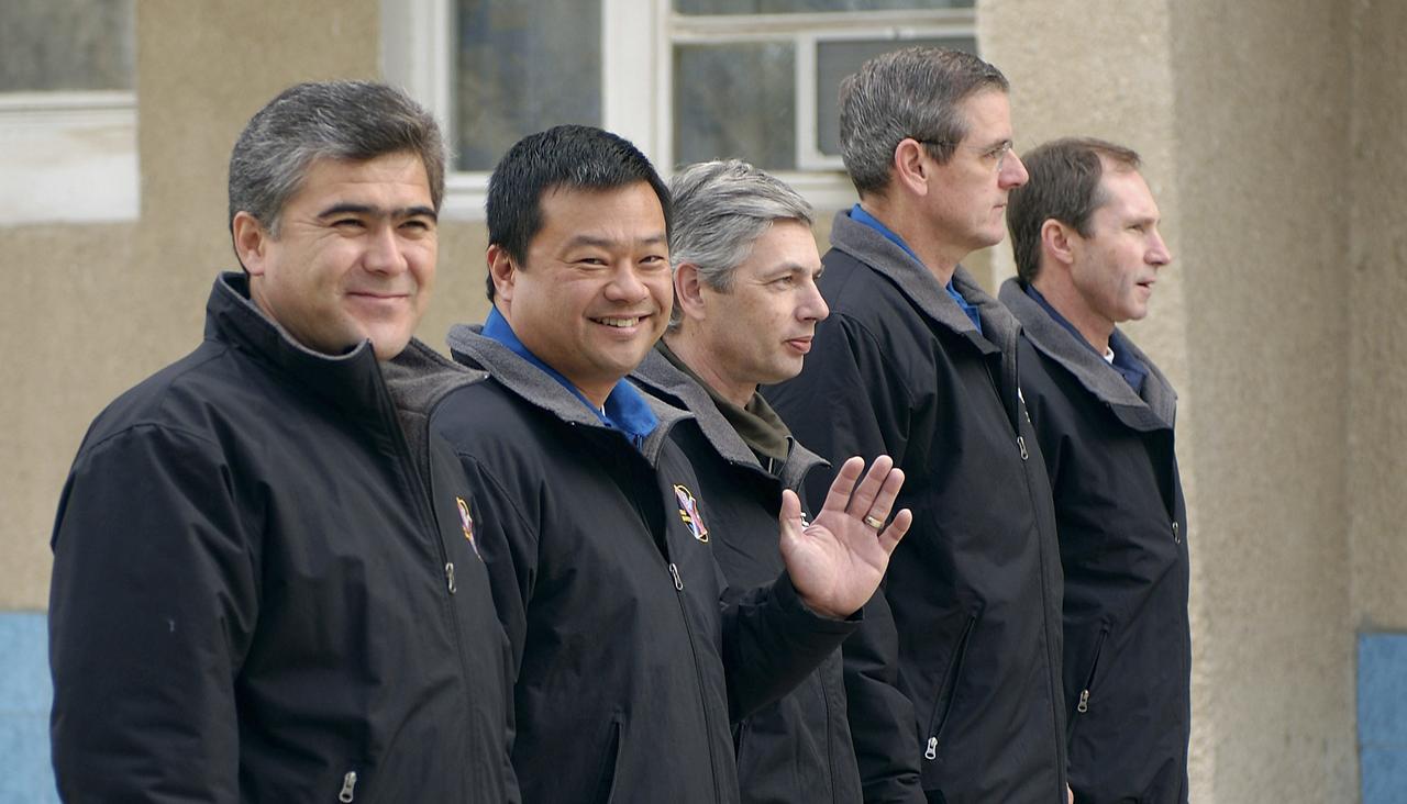 From left to right, Expedition 10 Flight Engineer and Soyuz Commander Salizhan Sharipov, Commander and NASA Science Officer Leroy Chiao, Russian Space Forces cosmonaut Yuri Shargin, backup Soyuz Commander Valery Tokarev and backup Expedition Commander Bill McArthur patricipate in the ceremonial flag raising at the Cosmonaut Hotel, Baikonur, Kazakhstan, Wednesday, Oct. 6, 2004. Chiao, Sharipov and Shargin are scheduled to launch October 14 on their Soyuz TMA-5 spacecraft to the International Space Station. Photo Credit: (NASA/Bill Ingalls)