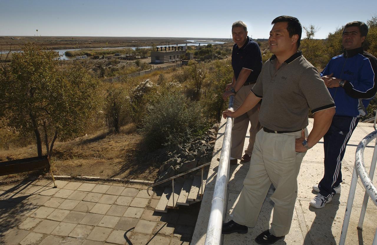 Flight Engineer and Soyuz Commander Salizhan Sharipov, right, Expedition 10 Commander Leroy Chiao and the lead Russian Flight Surgeon, left, enjoy a midday stroll down the Walkway of Cosmonauts at their crew quarters in Baikonur, Kazakhstan, Friday, October 8, 2004, as they prepare for liftoff to the International Space Station October 14.  Photo Credit: (NASA/Bill Ingalls)