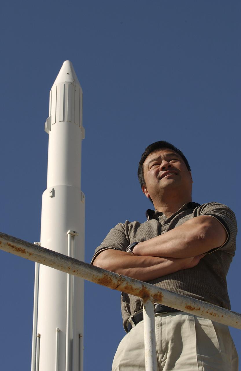 Expedition 10 Commander Leroy Chiao stands next to a model rocket on the grounds of the Cosmonaut Hotel in Baikonur, Kazakhstan, Friday, October 8, 2004, as they prepare for liftoff to the International Space Station October 14.  Photo Credit: (NASA/Bill Ingalls)