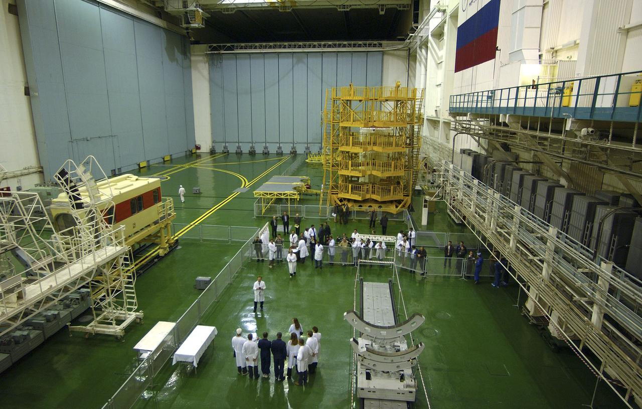 Expedition 10 backup Soyuz Commander Valery Tokarev, lower right in blue, and backup Expedition 10 Commander Bill McArthur stop and pose for photos after having completed their final inspection of the Soyuz spacecraft at buidling 254, Saturday, October 9, 2004, at Baikonur Cosmodrome in Kazakhstan. Expedition 10 is scheduled to launch October 14 on the Soyuz TMA-5 spacecraft to the International Space Station. Photo Credit: (NASA/Bill Ingalls)
