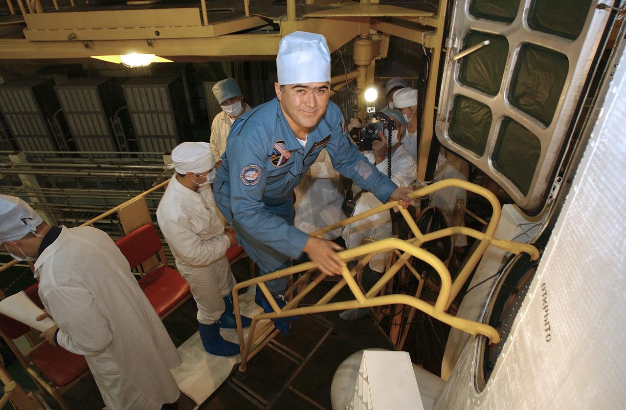 Flight Engineer and Soyuz Commander Salizhan Sharipov enters the Soyuz capsule for a final check Saturday, Oct. 9, 2004, at the Baikonur Cosmodrome in Kazakhstan. Expedition 10 is scheduled to launch October 14 on the Soyuz TMA-5 spacecraft to the International Space Station. Photo Credit: (NASA/Bill Ingalls)