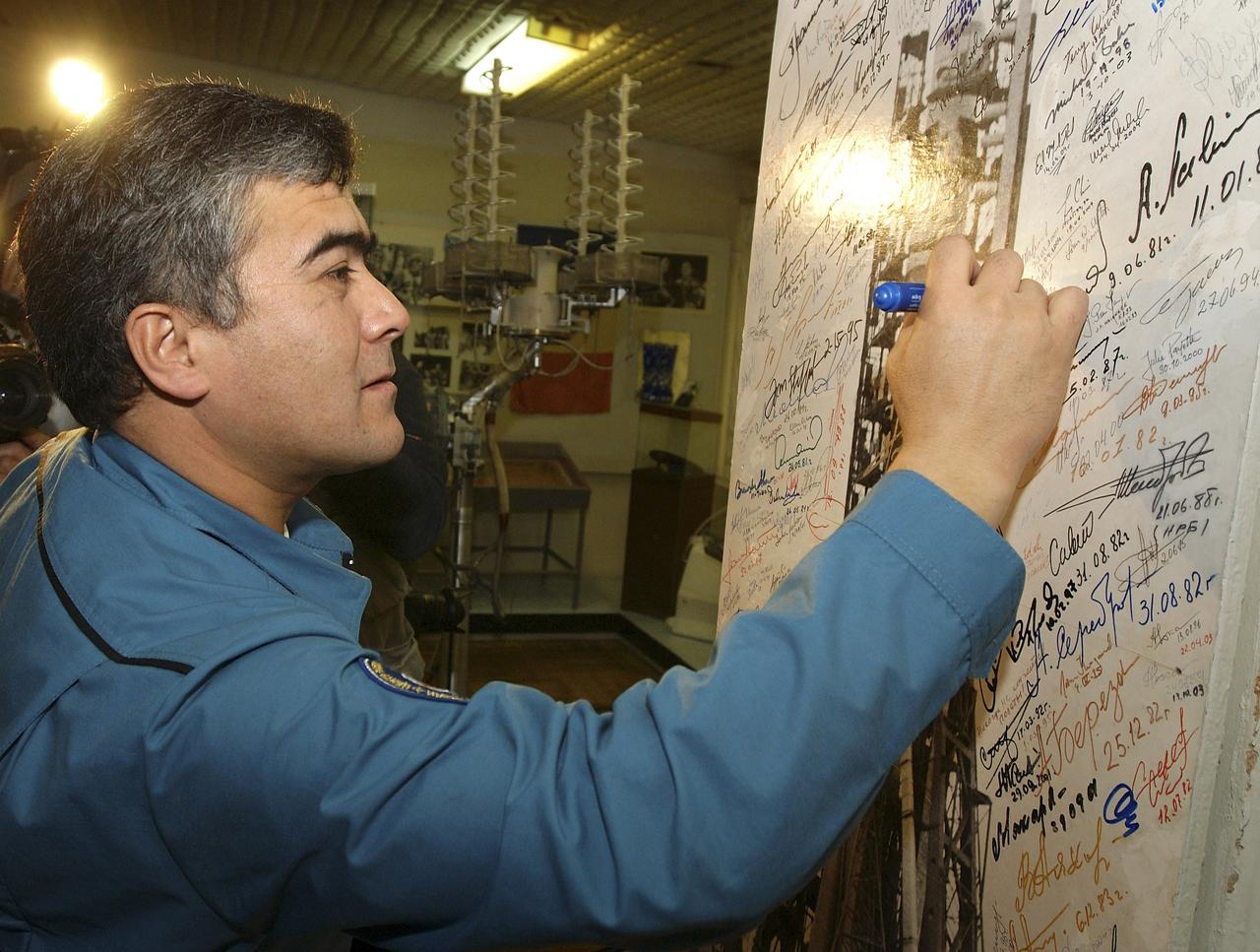 Flight Engineer and Soyuz Commander Salizhan Sharipov tours a museum bearing the name of historic Russian rocket designer Sergei Korolev, Saturday, October 9, 2004, at the Baikonur Cosmodrome in Kazakhstan in advance of their liftoff to the International Space Station October 14.  The traditional visit included the signing of their names in commemorative books and a wall at the museum, and touring the cottages nearby where Korolev and Yuri Gagarin slept on the eve of Gagarin's launch April 12, 1961 to become the first human in space.  Photo Credit: (NASA/Bill Ingalls)
