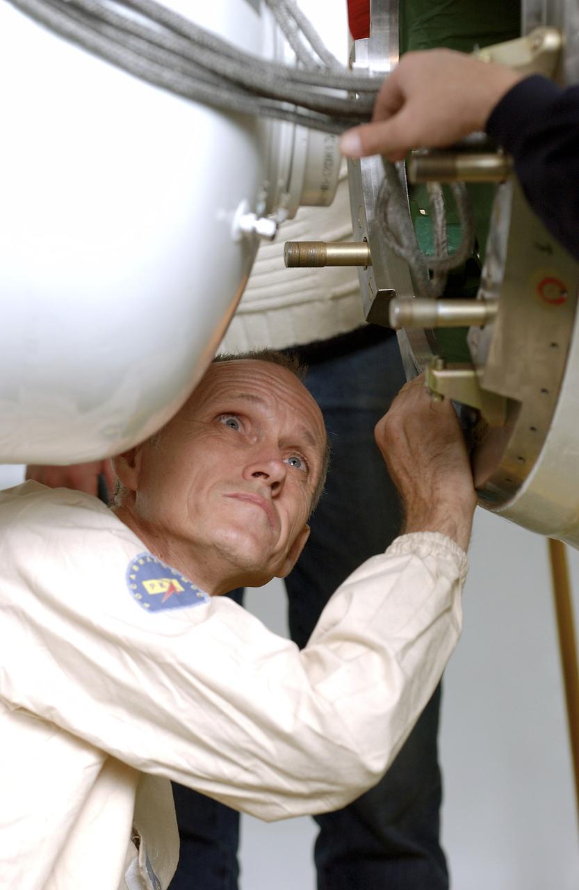The Soyuz TMA-5 spacecraft is mated to its booster rocket in a processing hangar at the Baikonur Cosmodrome in Kazakhstan Monday, October 11, 2004, in preparation for its rollout to the launch pad October 12 and its liftoff October 14 to carry Expedition 10 Commander and NASA Science Officer Leroy Chiao, Flight Engineer and Soyuz Commander Salizhan Sharipov and Russian Space Forces cosmonaut Yuri Shargin to the International Space Station.  Photo Credit: (NASA/Bill Ingalls)