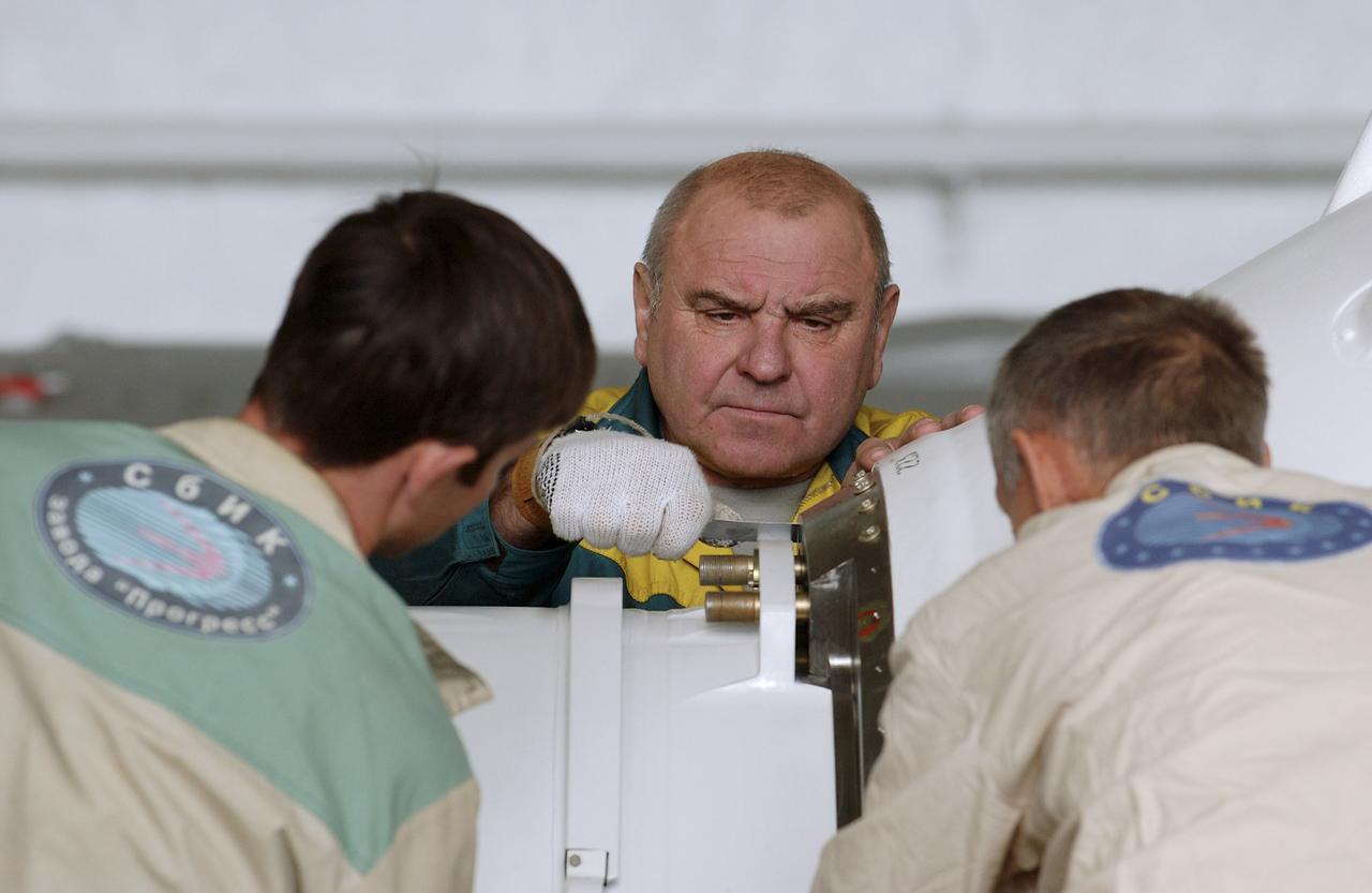 The Soyuz TMA-5 spacecraft is mated to its booster rocket in a processing hangar at the Baikonur Cosmodrome in Kazakhstan Monday, October 11, 2004, in preparation for its rollout to the launch pad October 12 and its liftoff October 14 to carry Expedition 10 Commander and NASA Science Officer Leroy Chiao, Flight Engineer and Soyuz Commander Salizhan Sharipov and Russian Space Forces cosmonaut Yuri Shargin to the International Space Station.  Photo Credit: (NASA/Bill Ingalls)