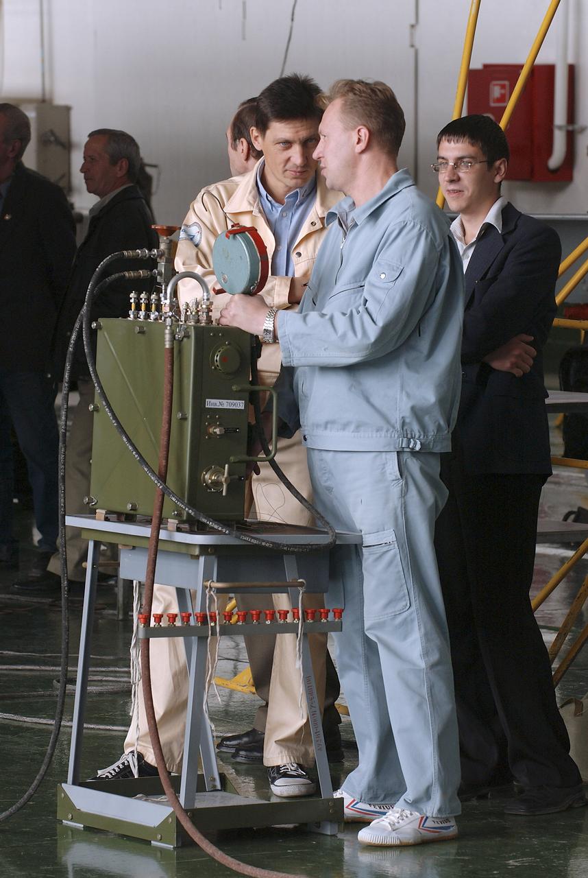 The Soyuz TMA-5 spacecraft is mated to its booster rocket in a processing hangar at the Baikonur Cosmodrome in Kazakhstan Monday, October 11, 2004, in preparation for its rollout to the launch pad October 12 and its liftoff October 14 to carry Expedition 10 Commander and NASA Science Officer Leroy Chiao, Flight Engineer and Soyuz Commander Salizhan Sharipov and Russian Space Forces cosmonaut Yuri Shargin to the International Space Station.  Photo Credit: (NASA/Bill Ingalls)
