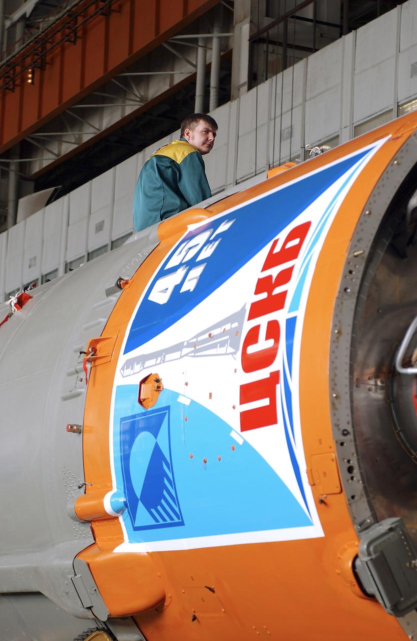 The Soyuz TMA-5 spacecraft is mated to its booster rocket in a processing hangar at the Baikonur Cosmodrome in Kazakhstan Monday, October 11, 2004, in preparation for its rollout to the launch pad October 12 and its liftoff October 14 to carry Expedition 10 Commander and NASA Science Officer Leroy Chiao, Flight Engineer and Soyuz Commander Salizhan Sharipov and Russian Space Forces cosmonaut Yuri Shargin to the International Space Station.  Photo Credit: (NASA/Bill Ingalls)
