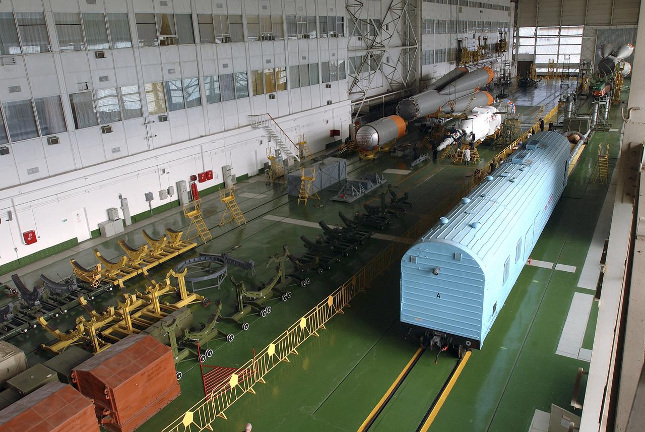 The Soyuz TMA-5 spacecraft is mated to its booster rocket in a processing hangar at the Baikonur Cosmodrome in Kazakhstan Monday, October 11, 2004, in preparation for its rollout to the launch pad October 12 and its liftoff October 14 to carry Expedition 10 Commander and NASA Science Officer Leroy Chiao, Flight Engineer and Soyuz Commander Salizhan Sharipov and Russian Space Forces cosmonaut Yuri Shargin to the International Space Station.  Photo Credit: (NASA/Bill Ingalls)