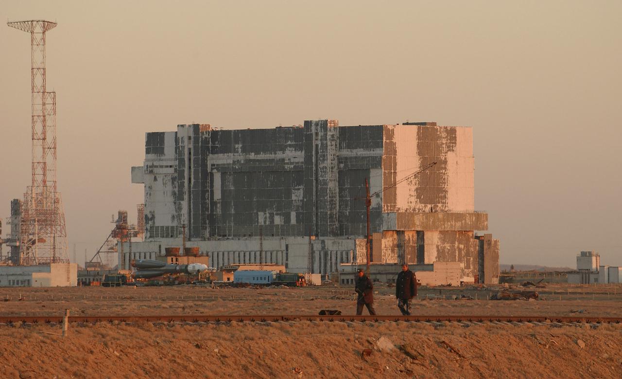 Security guards check the tracks ahead of the Soyuz.  The Soyuz TMA-5 vehicle rolled to its launch pad at the Baikonur Cosmodrome in Kazakhstan, Tuesday, October 12, 2004, in preparation for its launch October 14 to send Expedition 10 Commander and NASA Science Officer Leroy Chiao, Flight Engineer and Soyuz Commander Salizhan Sharipov and Russian Space Forces cosmonaut Yuri Shargin to the International Space Station.  Chiao and Sharipov will replace the Expedition 9 crew of Gennady Padalka and Mike Fincke, while Shargin will conduct eight days of scientific experiments.  He will return to earth with the Expedition 9 crew October 24.  Photo Credit: (NASA/Bill Ingalls)