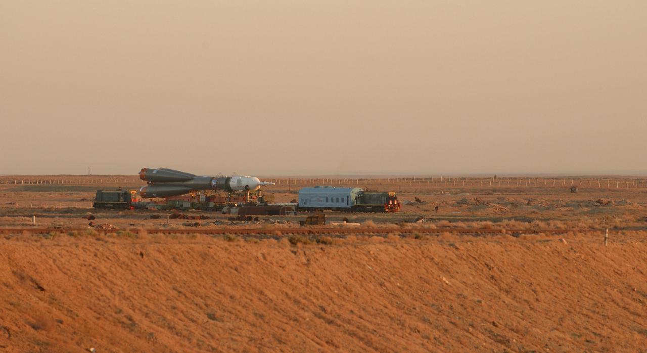 The Soyuz TMA-5 vehicle rolled to its launch pad at the Baikonur Cosmodrome in Kazakhstan, Tuesday, October 12, 2004, in preparation for its launch October 14 to send Expedition 10 Commander and NASA Science Officer Leroy Chiao, Flight Engineer and Soyuz Commander Salizhan Sharipov and Russian Space Forces cosmonaut Yuri Shargin to the International Space Station.  Chiao and Sharipov will replace the Expedition 9 crew of Gennady Padalka and Mike Fincke, while Shargin will conduct eight days of scientific experiments.  He will return to earth with the Expedition 9 crew October 24.  Photo Credit: (NASA/Bill Ingalls)