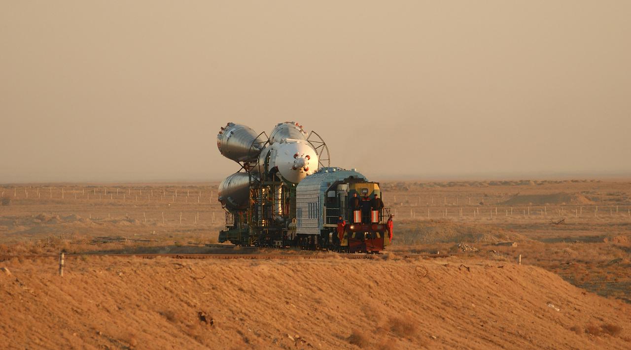 The Soyuz TMA-5 vehicle rolled to its launch pad at the Baikonur Cosmodrome in Kazakhstan, Tuesday, October 12, 2004, in preparation for its launch October 14 to send Expedition 10 Commander and NASA Science Officer Leroy Chiao, Flight Engineer and Soyuz Commander Salizhan Sharipov and Russian Space Forces cosmonaut Yuri Shargin to the International Space Station.  Chiao and Sharipov will replace the Expedition 9 crew of Gennady Padalka and Mike Fincke, while Shargin will conduct eight days of scientific experiments.  He will return to earth with the Expedition 9 crew October 24.  Photo Credit: (NASA/Bill Ingalls)