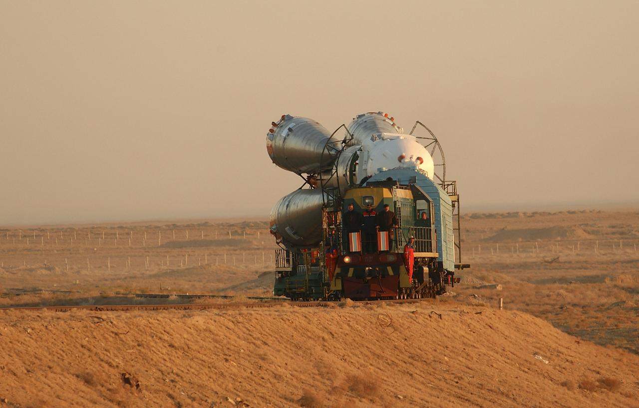 The Soyuz TMA-5 vehicle rolled to its launch pad at the Baikonur Cosmodrome in Kazakhstan, Tuesday, October 12, 2004, in preparation for its launch October 14 to send Expedition 10 Commander and NASA Science Officer Leroy Chiao, Flight Engineer and Soyuz Commander Salizhan Sharipov and Russian Space Forces cosmonaut Yuri Shargin to the International Space Station.  Chiao and Sharipov will replace the Expedition 9 crew of Gennady Padalka and Mike Fincke, while Shargin will conduct eight days of scientific experiments.  He will return to earth with the Expedition 9 crew October 24.  Photo Credit: (NASA/Bill Ingalls)