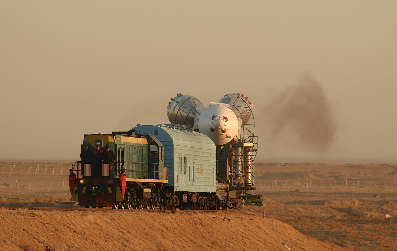 The Soyuz TMA-5 vehicle rolled to its launch pad at the Baikonur Cosmodrome in Kazakhstan, Tuesday, October 12, 2004, in preparation for its launch October 14 to send Expedition 10 Commander and NASA Science Officer Leroy Chiao, Flight Engineer and Soyuz Commander Salizhan Sharipov and Russian Space Forces cosmonaut Yuri Shargin to the International Space Station.  Chiao and Sharipov will replace the Expedition 9 crew of Gennady Padalka and Mike Fincke, while Shargin will conduct eight days of scientific experiments.  He will return to earth with the Expedition 9 crew October 24.  Photo Credit: (NASA/Bill Ingalls)