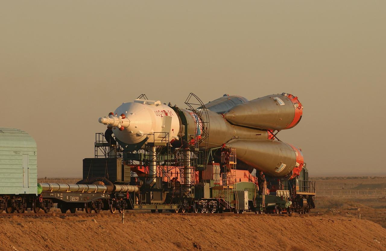 The Soyuz TMA-5 vehicle rolled to its launch pad at the Baikonur Cosmodrome in Kazakhstan, Tuesday, October 12, 2004, in preparation for its launch October 14 to send Expedition 10 Commander and NASA Science Officer Leroy Chiao, Flight Engineer and Soyuz Commander Salizhan Sharipov and Russian Space Forces cosmonaut Yuri Shargin to the International Space Station.  Chiao and Sharipov will replace the Expedition 9 crew of Gennady Padalka and Mike Fincke, while Shargin will conduct eight days of scientific experiments.  He will return to earth with the Expedition 9 crew October 24.  Photo Credit: (NASA/Bill Ingalls)