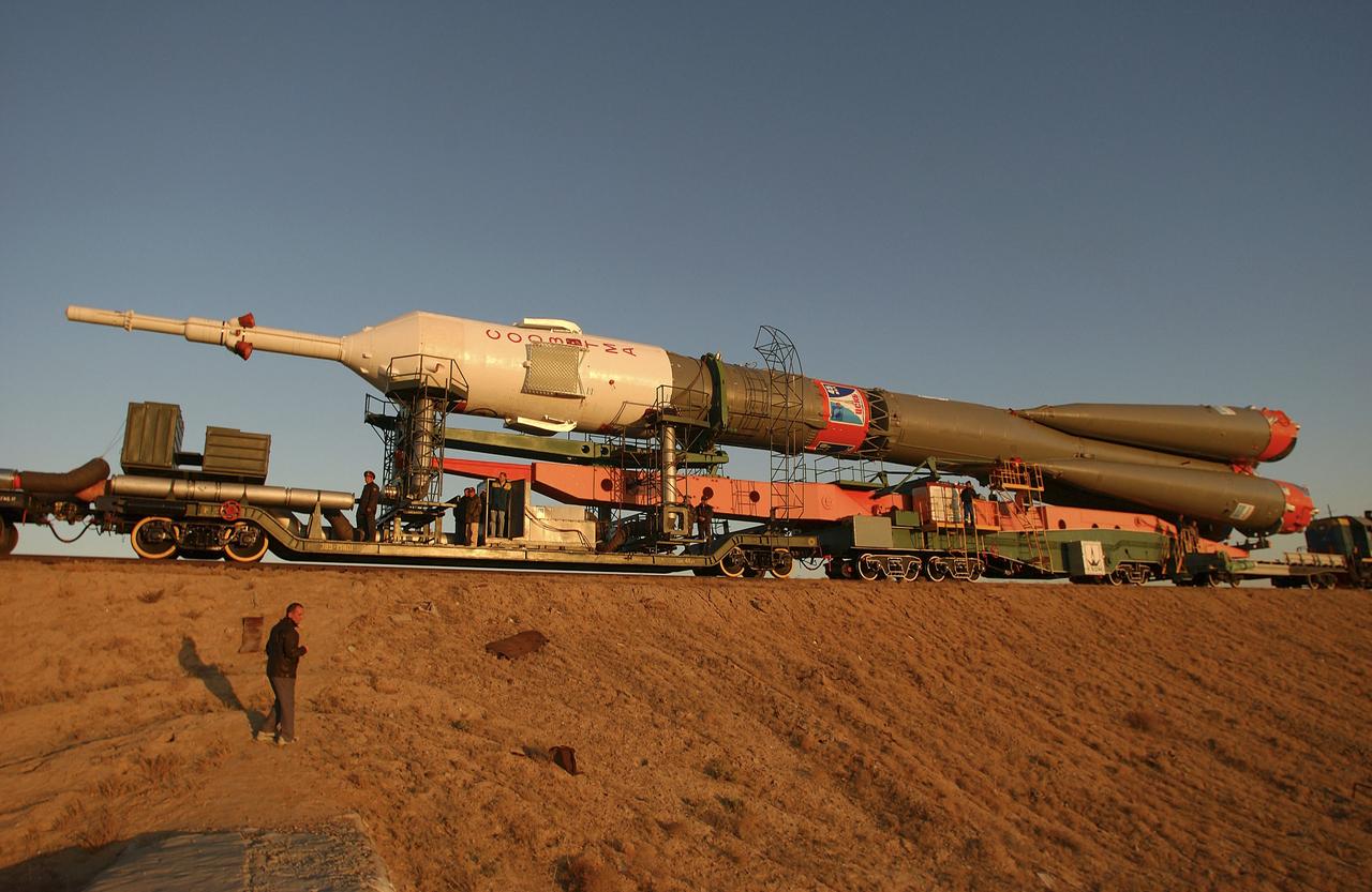 The Soyuz TMA-5 vehicle rolled to its launch pad at the Baikonur Cosmodrome in Kazakhstan, Tuesday, October 12, 2004, in preparation for its launch October 14 to send Expedition 10 Commander and NASA Science Officer Leroy Chiao, Flight Engineer and Soyuz Commander Salizhan Sharipov and Russian Space Forces cosmonaut Yuri Shargin to the International Space Station.  Chiao and Sharipov will replace the Expedition 9 crew of Gennady Padalka and Mike Fincke, while Shargin will conduct eight days of scientific experiments.  He will return to earth with the Expedition 9 crew October 24.  Photo Credit: (NASA/Bill Ingalls)