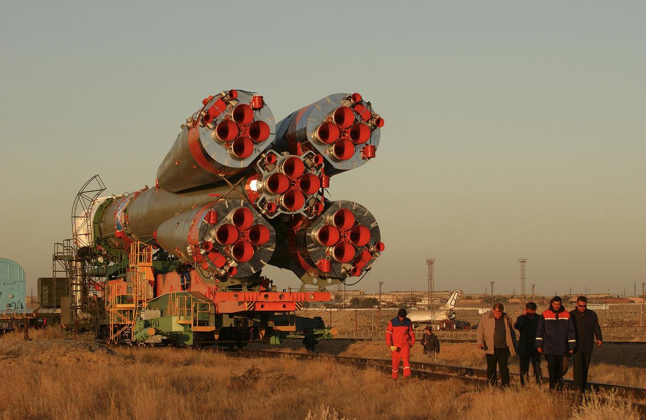 The Soyuz TMA-5 vehicle rolled to its launch pad at the Baikonur Cosmodrome in Kazakhstan, Tuesday, October 12, 2004, in preparation for its launch October 14 to send Expedition 10 Commander and NASA Science Officer Leroy Chiao, Flight Engineer and Soyuz Commander Salizhan Sharipov and Russian Space Forces cosmonaut Yuri Shargin to the International Space Station. Chiao and Sharipov will replace the Expedition 9 crew of Gennady Padalka and Mike Fincke, while Shargin will conduct eight days of scientific experiments. He will return to earth with the Expedition 9 crew October 24. Photo Credit: (NASA/Bill Ingalls)